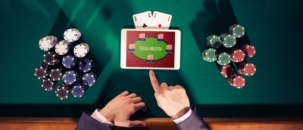 Tablet with casino app sitting on poker table.