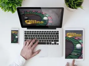 Casino app displayed on a phone, tablet and laptop.
