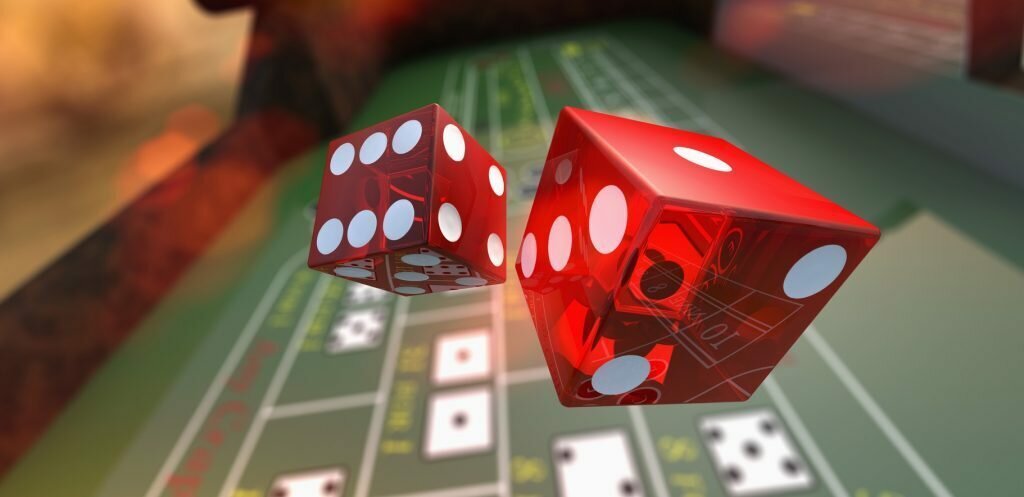 Dice falling onto a craps table. 